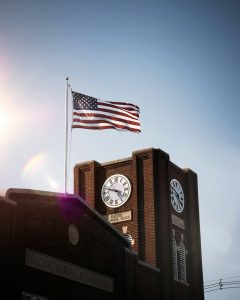 US flag flying over small town building